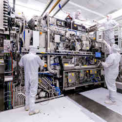 ASML employees assembling an EUV lithography system