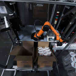 A Rapid Robotics robot moves a product in a Westec Plastics Corp warehouse in Livermore, CA