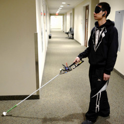 VCU's Lingqiu Jin tests the robotic cane