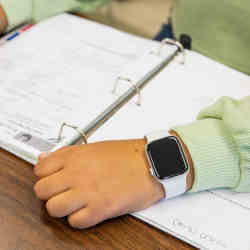 A student wearing a smartwatch.