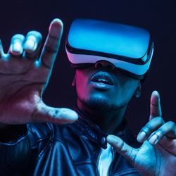 African-American young man wearing virtual reality headset