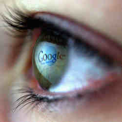 The Google logo reflected in a woman's eye.