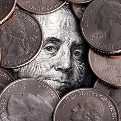 Franklin's face from $100 bill surrounded by quarters