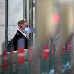 A man entering the turnstile of the Moscow metro, which uses the Face Pay facial recognition system.