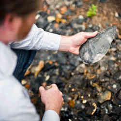 Examining a Late Acheulean hand axe.