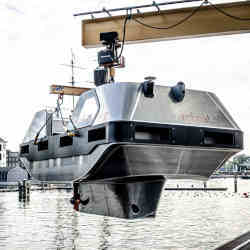 A Roboat being lowered into an Amsterdam canal.