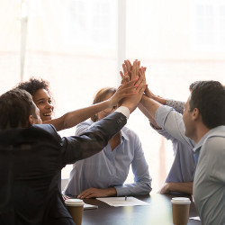 businesspeople giving high-fives