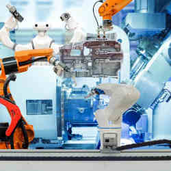 Industrial robots working together.