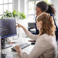 Women working on a technology project. 