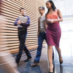 workers walking in a hallway