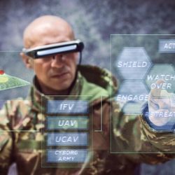 Futuristic soldier uses virtual and augmented reality.