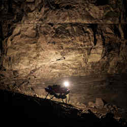 A CERBERUS robot navigates the cavern during the DARPA Subterranean Challenge.