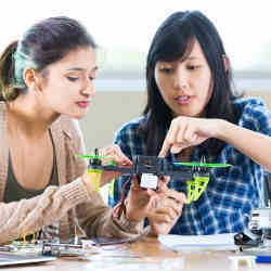 Young women working on a science project. 