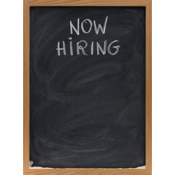 'Now Hiring' on chalkboard