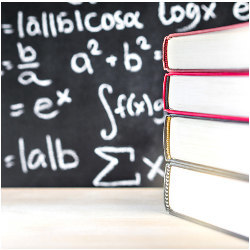 stack of books and a blackboard