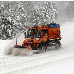 snowplow operating in a storm