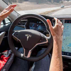 A driver uses Tesla Autopilot.