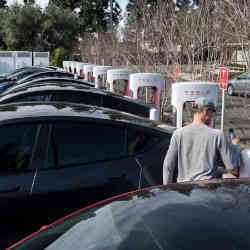 esla cars at a charging station in Irvine, CA.