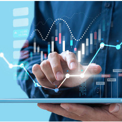 data charts over hand touching a tablet computer 