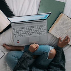 student at laptop computer