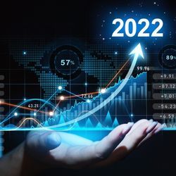 Mixed-media image shows a stock chart showing a sharp rise in 2022.