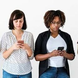 Two women using smartphones.