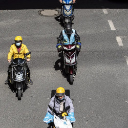 fast-food couriers on electric bikes in China