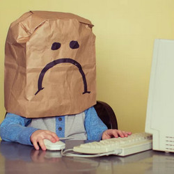 brown bag sad face on PC user