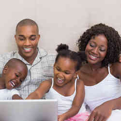 A happy family exploring the Internet together.