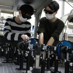 Tohoku University's Shun Kanai and Yuichiro Abe working in a lab