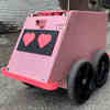 Meet Geoffrey, the Pink Robot with Heart-Shaped Eyes that Delivers Coffee in Charlotte