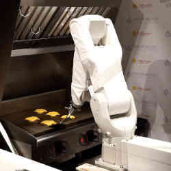 A burger-flipping robot at work.