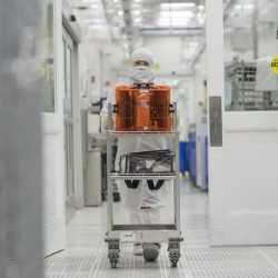 technician pushes a wafer cart at an Applied Materials facility in California