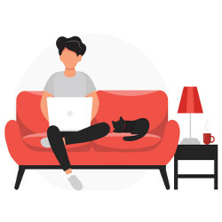 woman working on a laptop computer sits next to a cat on a sofa