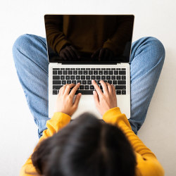 overhead view of a woman at a laptop computer