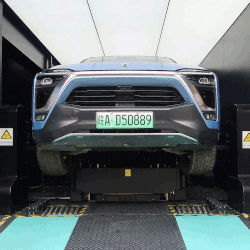 A Nio ES8 undergoing a battery swap inside a power station at a JAC Motors-Nio plant in Hefei, Anhui province, China.