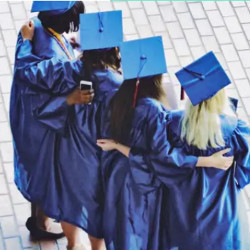 four graduates in caps and gowns pose for a photo