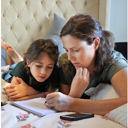 mother helping daughter with homework