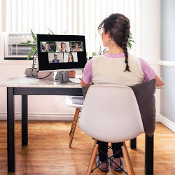 woman wearing slippers attends online meeting