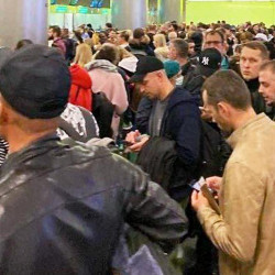 men seeking flights to leave Russia