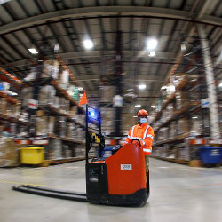 An employee at the Amazon logistics center in Slzetal, Germany