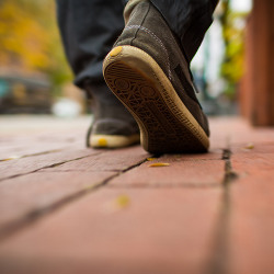 feet walking on pavement