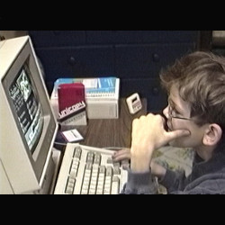 camcorder image of Benj Edwards at his IBM PS/2 model 25 in 1992