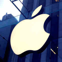 The Apple Inc. logo hanging at the entrance to the Apple store on 5th Avenue in Manhattan, NY.