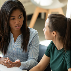 two female students in discussion