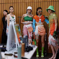 Models waiting backstage before the "Fashion X AI: Call For Young Talents 2022" fashion show in Hong Kong, China. 