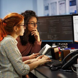 two women working at a computer