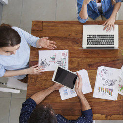 three Gen Z workers at a business meeting