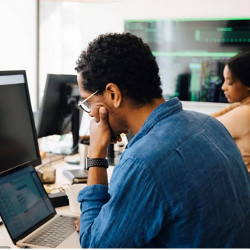 two coders at computers