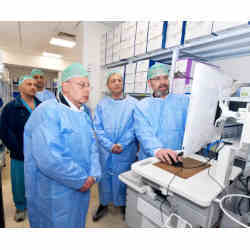 In blue from left, Galilee Medical Center director-general Masad Barhoum, Sarel CEO Avi Buskila, and Autonomi CEO Yoav Kastel.